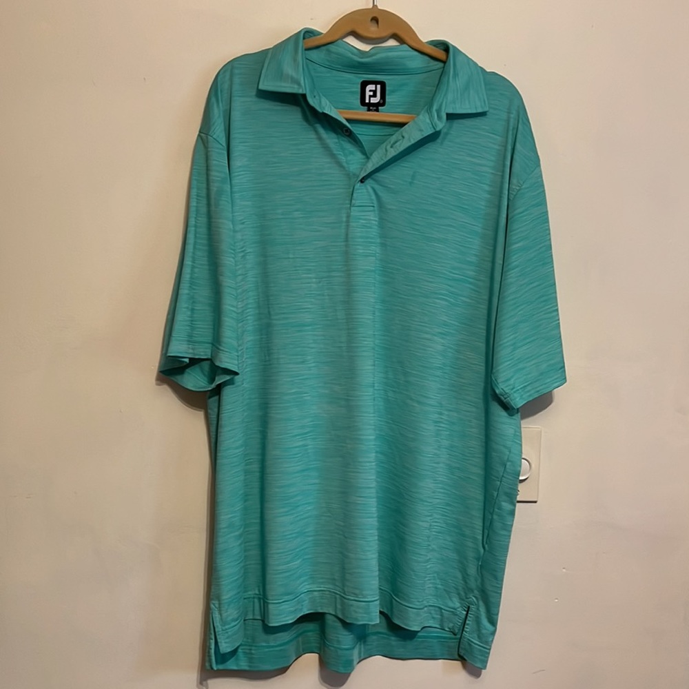 FJ golf shirt with Grand National club logo on 1 sleeve